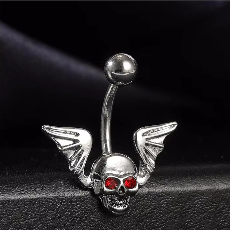 Piercing Nombril Tête de Mort Ailée en Acier et Zircons Rouges – Image 4