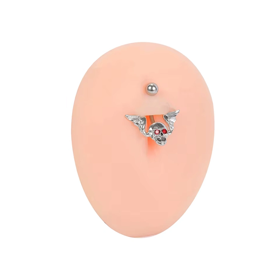 Piercing Nombril Tête de Mort Ailée en Acier et Zircons Rouges – Image 5